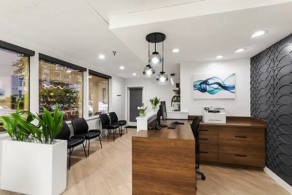 Chiropractic Renton WA Behind Desk