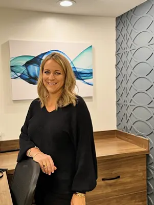 Chiropractic Renton WA Megan Winger Behind Desk