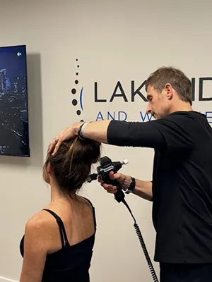 Chiropractor Renton WA Andy Winger Adjusting Patients Neck