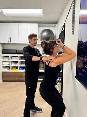 Chiropractor Renton WA Andy Winger Helping Patient Stretch Neck